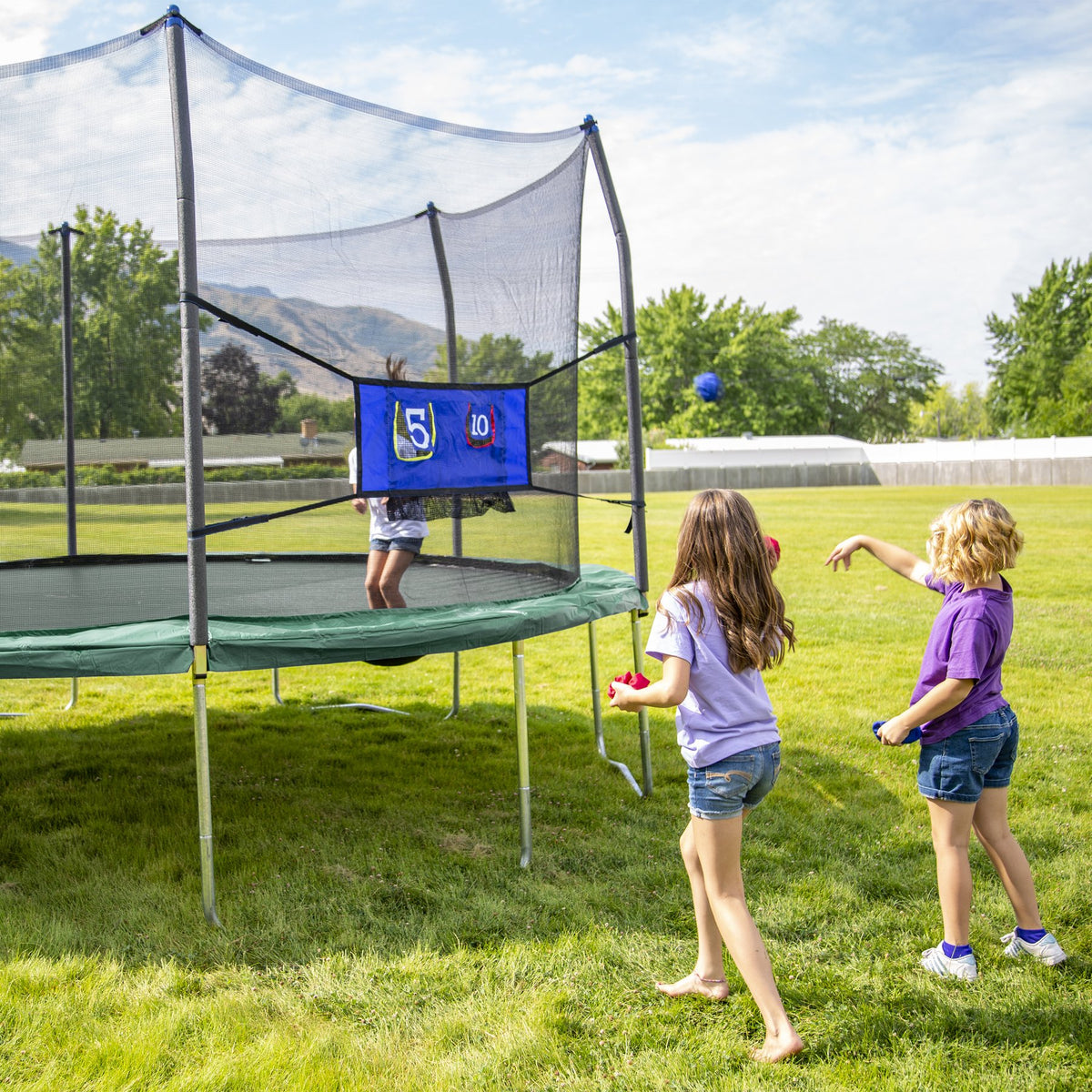 Skywalker Trampolines 16’ Oval Trampoline with Enclosure and Toss Game