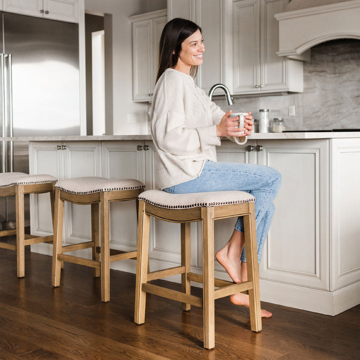 Maven Lane Adrien Saddle Counter Stool in Natural Wood Finish w/ Wheat Cream Fabric Upholstery