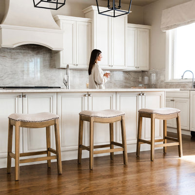 Maven Lane Adrien Saddle Counter Stool in Natural Wood Finish w/ Wheat Cream Fabric Upholstery