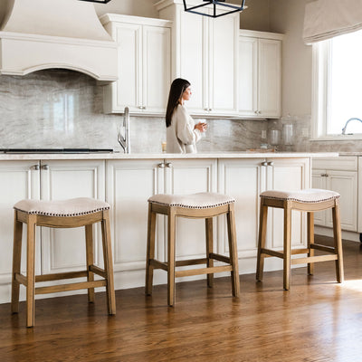 Maven Lane Adrien Saddle Barstool in Natural Wood Finish w/ Wheat Cream Fabric Upholstery