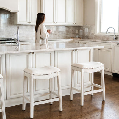 Maven Lane Adrien Saddle Counter Stool in White Oak Finish w/ Natural Fabric Upholstery