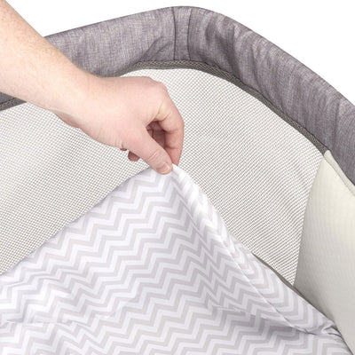 Evenflo Loft Portable Bassinet Crib with Bluetooth Speaker, Chevron Melange Gray