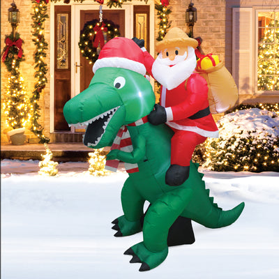 A Holiday Company 6' Tall Inflatable Santa on Dinosaur Holiday Lawn Decoration