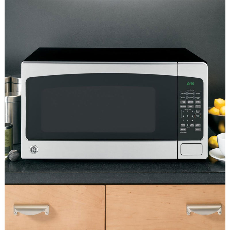 GE 2.0 Cu Ft Countertop Microwave Oven, Silver (Damaged)